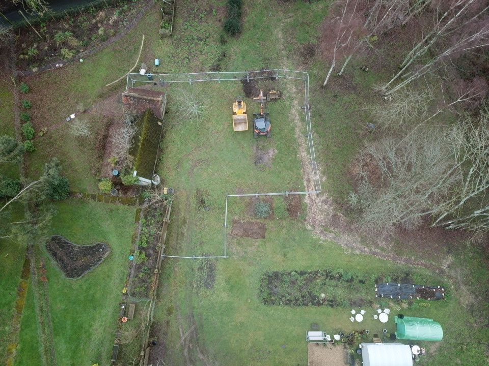 Drone view of the Bolney plot in January 2021: an open field before any work