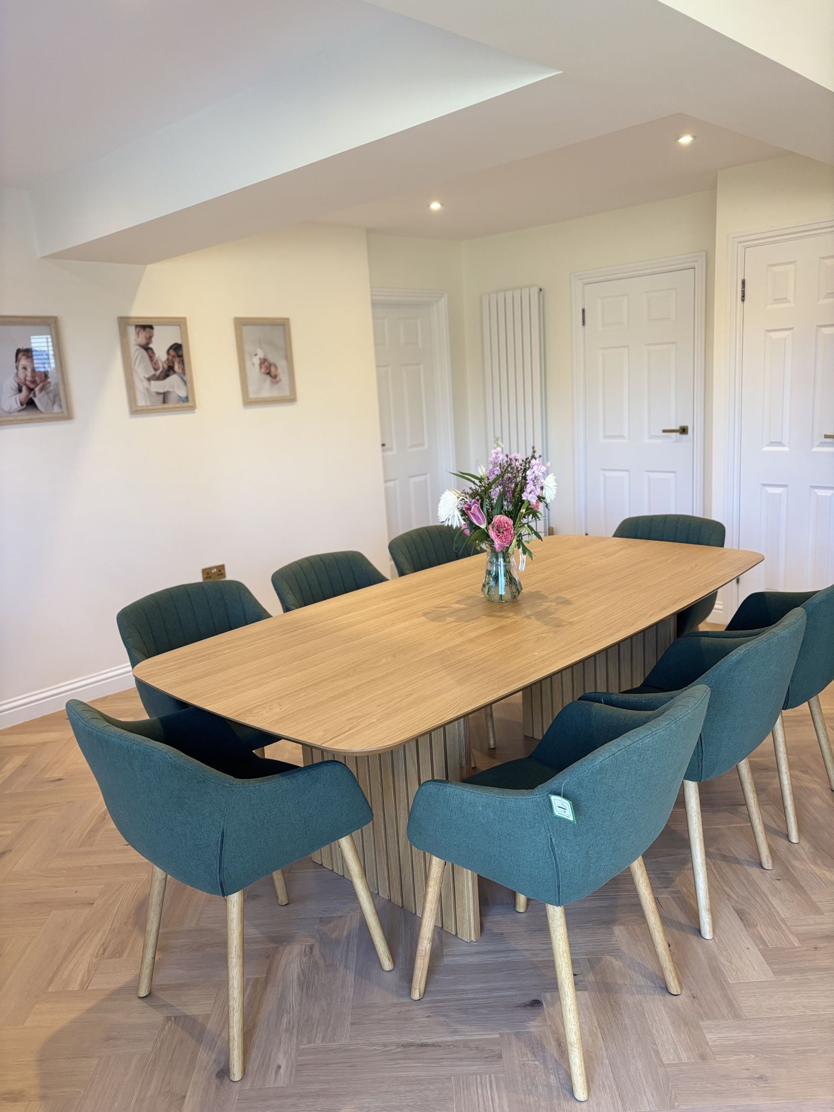 Grinstead Lane dining area after, with green chairs and herringbone floor