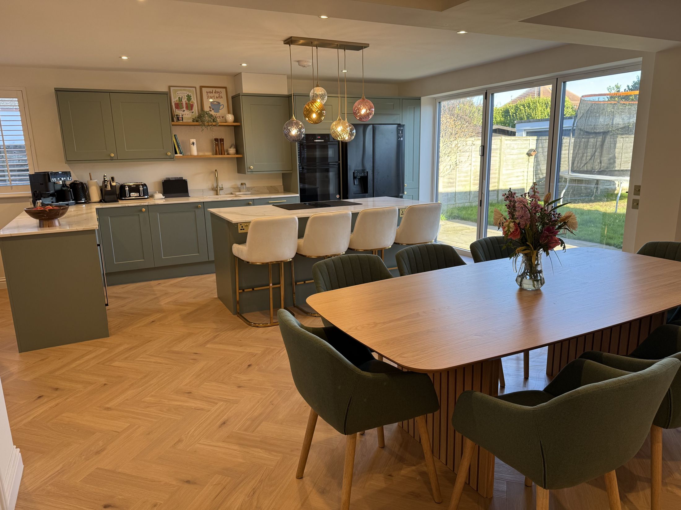 Grinstead Lane open-plan kitchen and dining room with the garden beyond