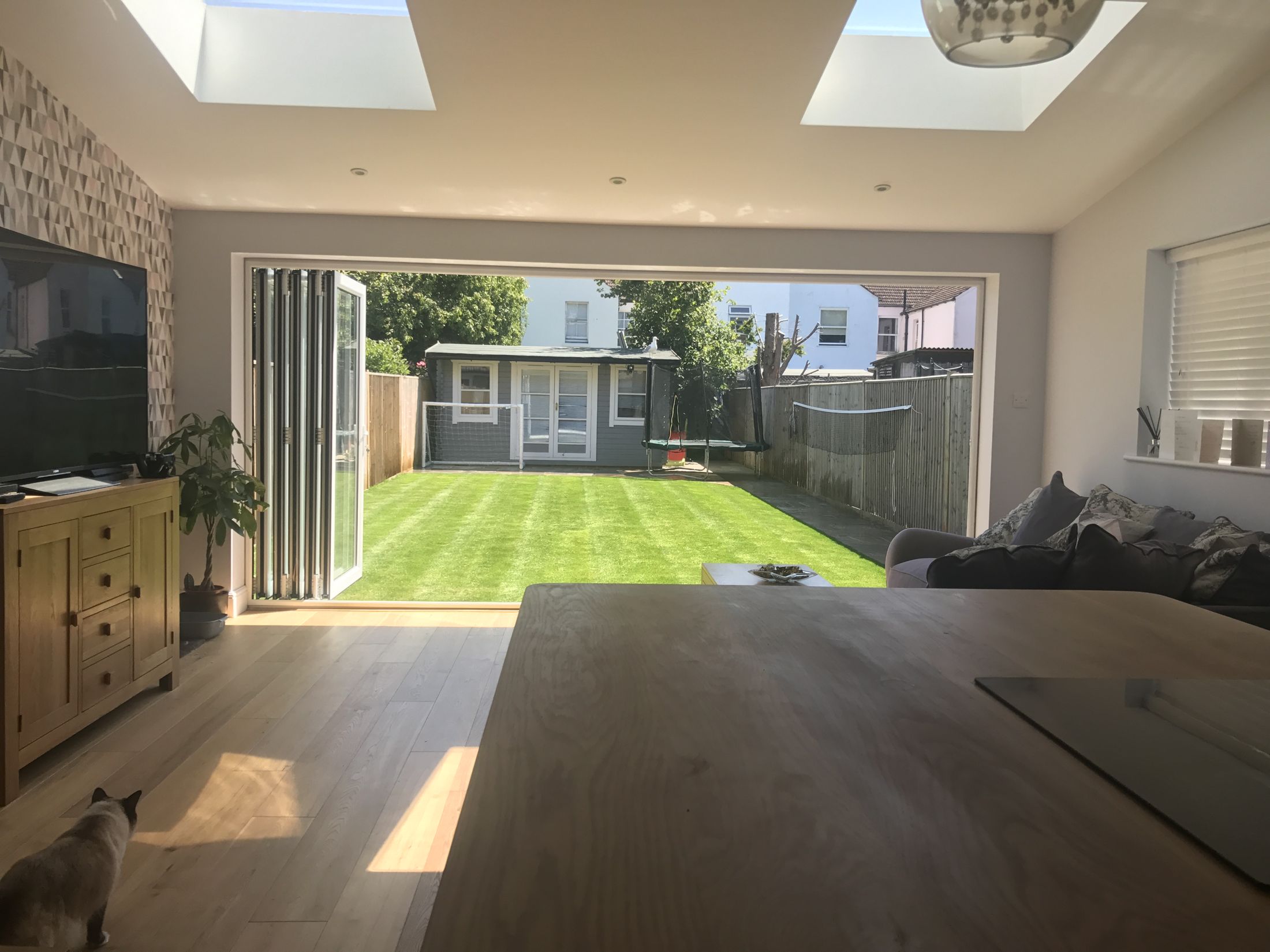 View from the St Andrews kitchen through open bifolds to the garden